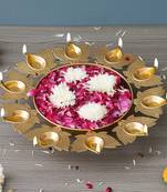 One golden metal handcrafted traditional designer urli with 9 lotus shape diyas