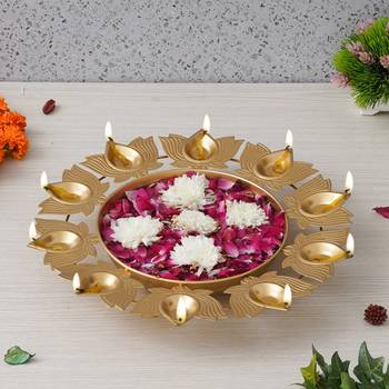 One golden metal handcrafted traditional designer urli with 9 lotus shape diyas 2