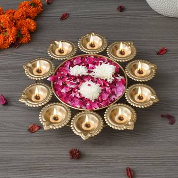 One golden metal handcrafted designer urli with 10 diyas 1