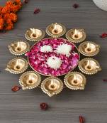 One golden metal handcrafted designer urli with 10 diyas