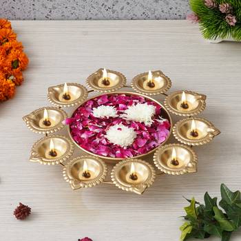 One golden metal handcrafted designer urli with 10 diyas 2