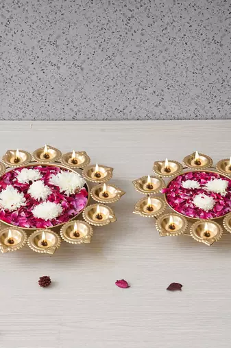 One set of 2 golden metal handcrafted flower shape designer urlis with diyas