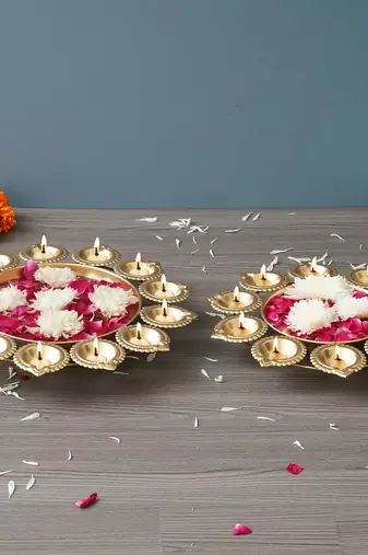 One set of 2 golden metal handcrafted flower shape designer urlis with diyas