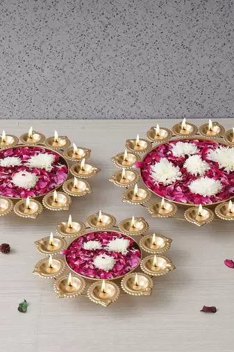 One set of 3 golden metal handcrafted flower shape designer urlis with diyas