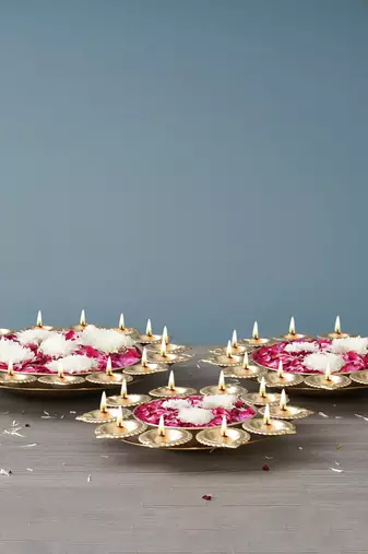 One set of 3 golden metal handcrafted flower shape designer urlis with diyas