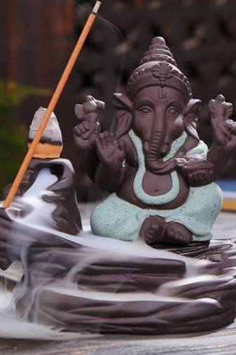 One green lord ganesha decorative showpiece with 10 free smoke backflow scented cone incenses