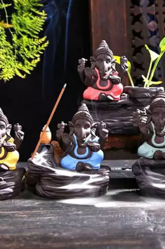 One green lord ganesha decorative showpiece with 10 free smoke backflow scented cone incenses