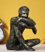 One man sitting in thinking position decorative statue