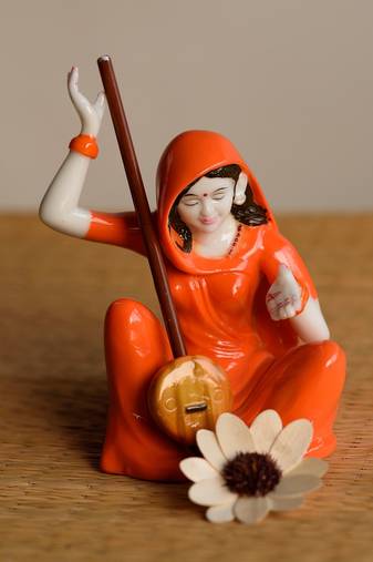 One mirabal playing musical instrument showpiece