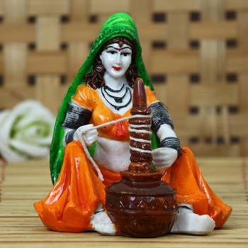 One rajasthani lady using makhan handi handcrafted decorative polyresin showpiece 1