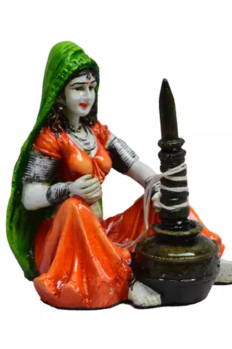One rajasthani lady using makhan handi handcrafted decorative polyresin showpiece