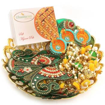 Diwali hampers-golden basket hamper of mysore pak, ,toran, rangoli and a set of 6 diyas 1