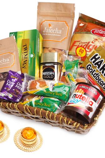 Brown cane like basket hamper  of 20 goodies with 2 t-lites