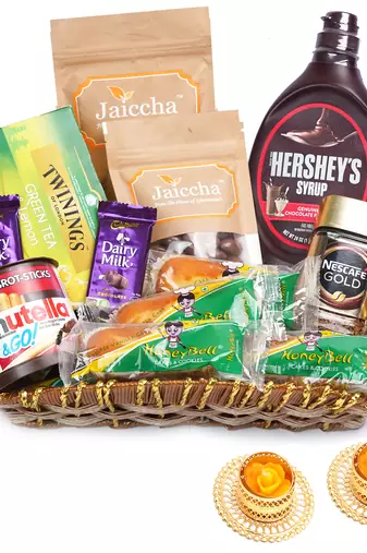 Brown cane like basket hamper  of 18 goodies with 2 t-lites