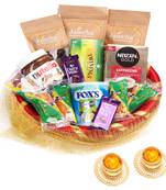 Golden net basket hamper  of 20 goodies with 2 t-lites