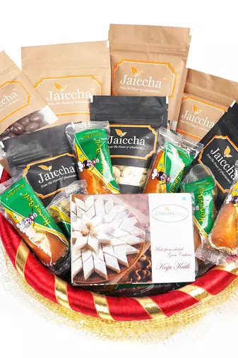 Golden net basket hamper  of 18 goodies