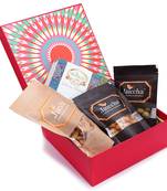Red hamper box of assorted bites, crunchy coated cashews, crunchy coated peanuts, butter chakli sticks