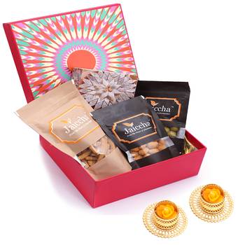 Red hamper box of kaju katlis, crunchy coated cashews, crunchy coated peanuts, butter chakli sticks and t-lites 1