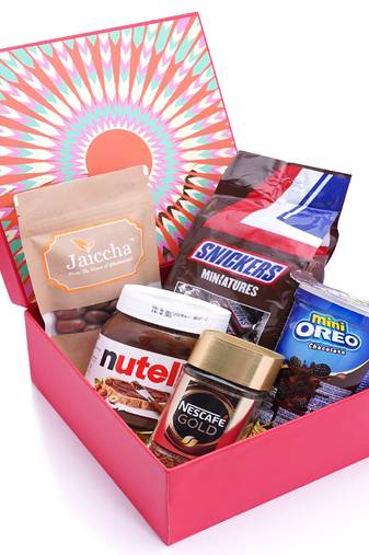 Red hamper box of snickers, chocolate coated almonds, nescafe gold coffee (50 gms), nutella and mini oreo