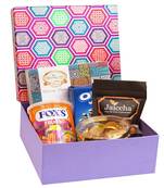 Gourmet hamper box of crunchy coated cashews, oreo wafer, foxs, coin chocolates and assorted bites box