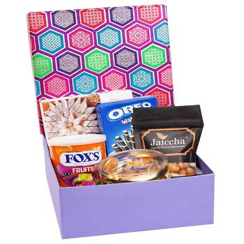 Gourmet hamper box of crunchy coated cashews, oreo wafer roll, fox tin, gold coin chocolates and kaju katli box 1