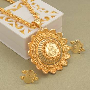 Gold plated lotus lakshmi pendant with matching earrings 1