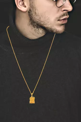 Gold-Plated Brass Pendant Necklace With Intricate Carved Design
