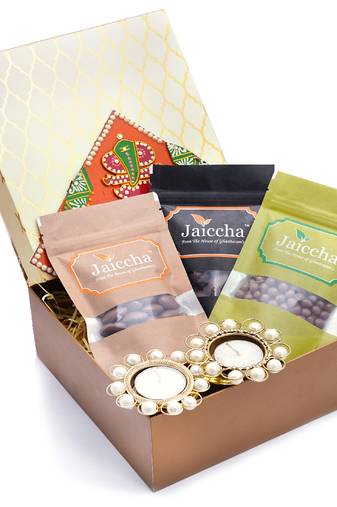 Golden hamper box of chocoate coated almonds, chocolate coated cashews, chocolate coated raisins.