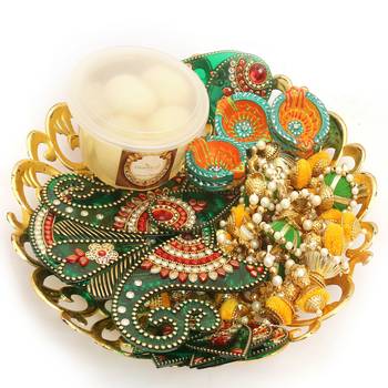 Diwali hampers-golden basket hamper of rasgulla, ,toran, rangoli and a set of 6 diyas 1