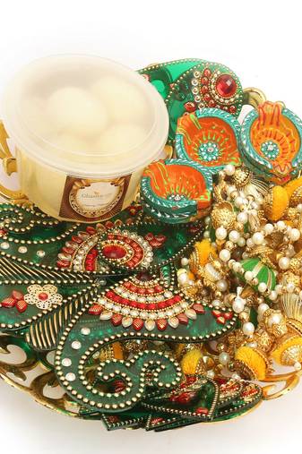 Diwali hampers-golden basket hamper of rasgulla, ,toran, rangoli and a set of 6 diyas