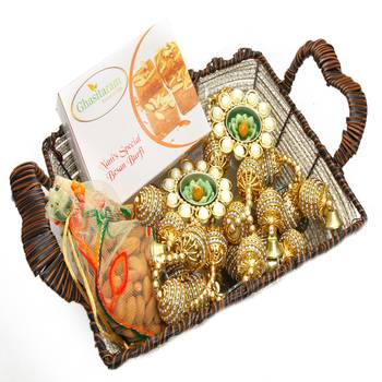 Diwali hampers-brown cane basket with besan barfi, almonds, toran  and 2 t-lites 1