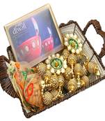 Diwali hampers-brown cane basket with happy diwali chocolate box, almonds, toran  and 2 t-lites