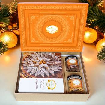 Ghasitaram orange hamper box with kaju katli , choco almonds, and crunchy cashews 1