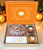Ghasitaram orange hamper box with kaju katli , choco almonds, and crunchy cashews