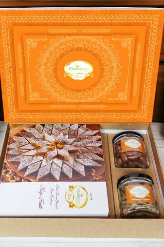 Ghasitaram orange hamper box with kaju katli , choco almonds, and paan raisins