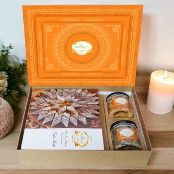 Ghasitaram orange hamper box with kaju katli, paan raisins and crunchy cashews 1