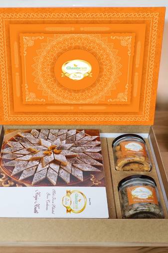 Ghasitaram orange hamper box with kaju katli, paan raisins and crunchy cashews