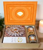 Ghasitaram orange hamper box with kaju katli, paan raisins and crunchy cashews