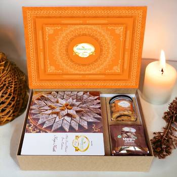 Ghasitaram orange hamper box with kaju katli, mewa bites and crunchy cashews 1