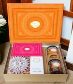 Ghasitaram orange hamper box with kaju katli, milk cake, choco coated almonds and crunchy cashews