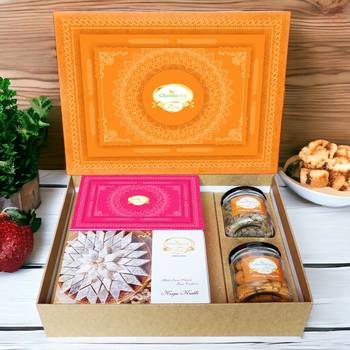 Ghasitaram orange hamper box with kaju katli, milk cake, paan raisins and crunchy cashews 1
