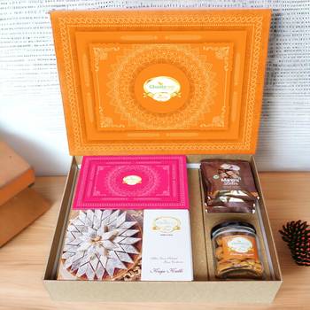 Ghasitaram orange hamper box with kaju katli, milk cake,mewa bites and crunchy cashews 1