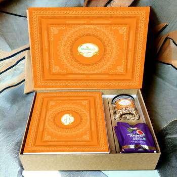 Ghasitaram orange hamper box with sugarfree kaju katli, sugarfree bites and wheat puffs 1
