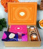 Ghasitaram orange hamper box with sugarfree kaju katli, beetroot chips, wheat puffs and moong chakli