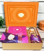 Ghasitaram orange hamper box with sugarfree kaju katli, beetroot chips, wheat puffs and sugafree bites