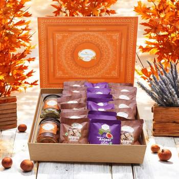 Ghasitaram orange hamper box of  24 pcs mewa and sugarfree anjeer bites, mixed dryfruit jar and flavour raisins jar 1