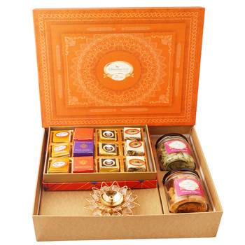 Orange hamper box with best bites, crunchy cashew, flavour raisins, and diya 1