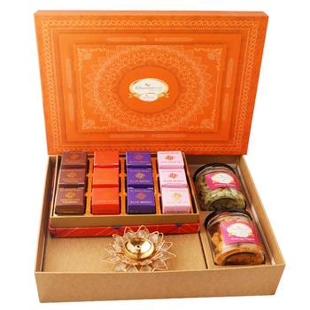 Orange hamper box with sugarfree bites, crunchy cashew, flavour raisins, and diya 1