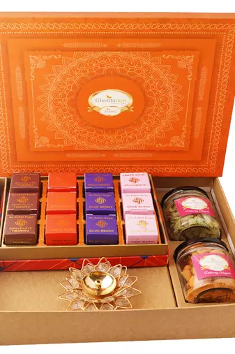 Orange hamper box with sugarfree bites, crunchy cashew, flavour raisins, and diya
