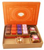 Orange hamper box with sugarfree bites, crunchy cashew, flavour raisins, and diya